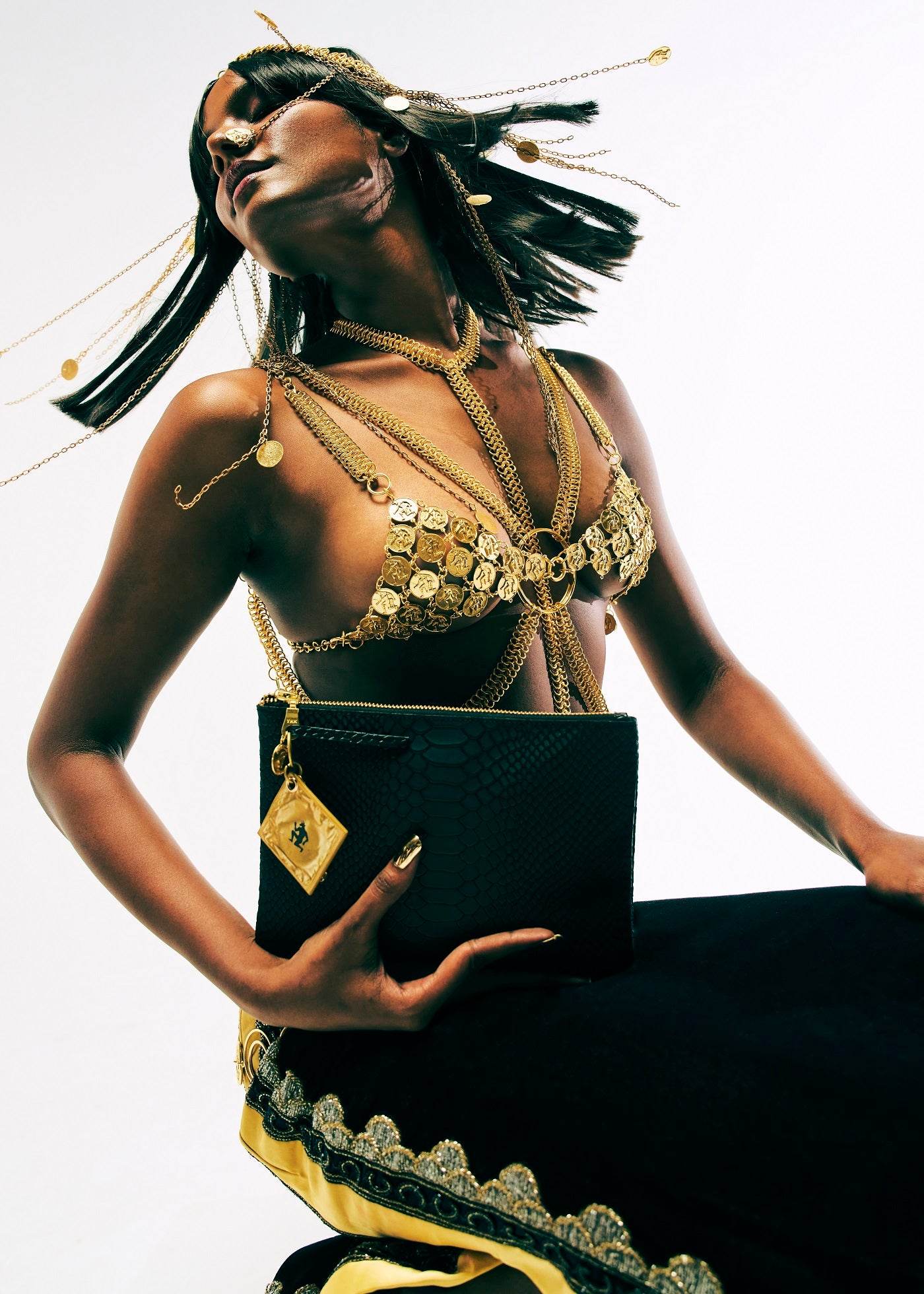 Metal couture collection with petal bras coin bikinis and armour by Subculture