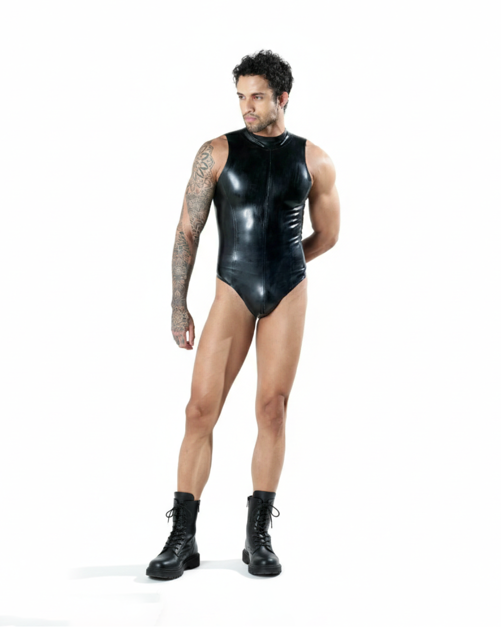 Person wearing a black leather bodysuit on a white background