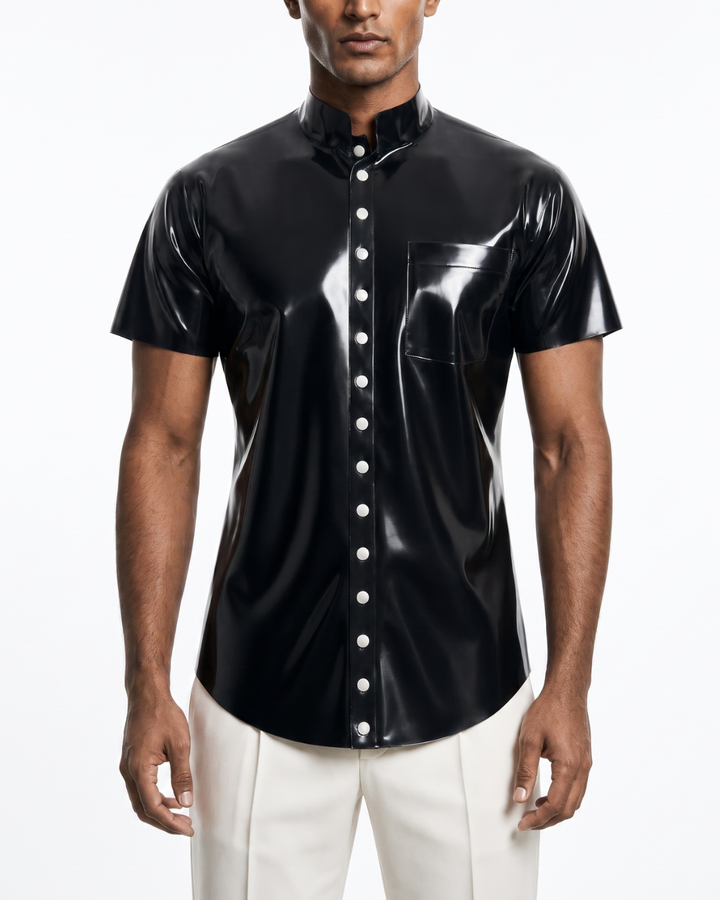 Model wearing black latex short sleeve shirt with snap stud placket, high collar and chest pocket, front view