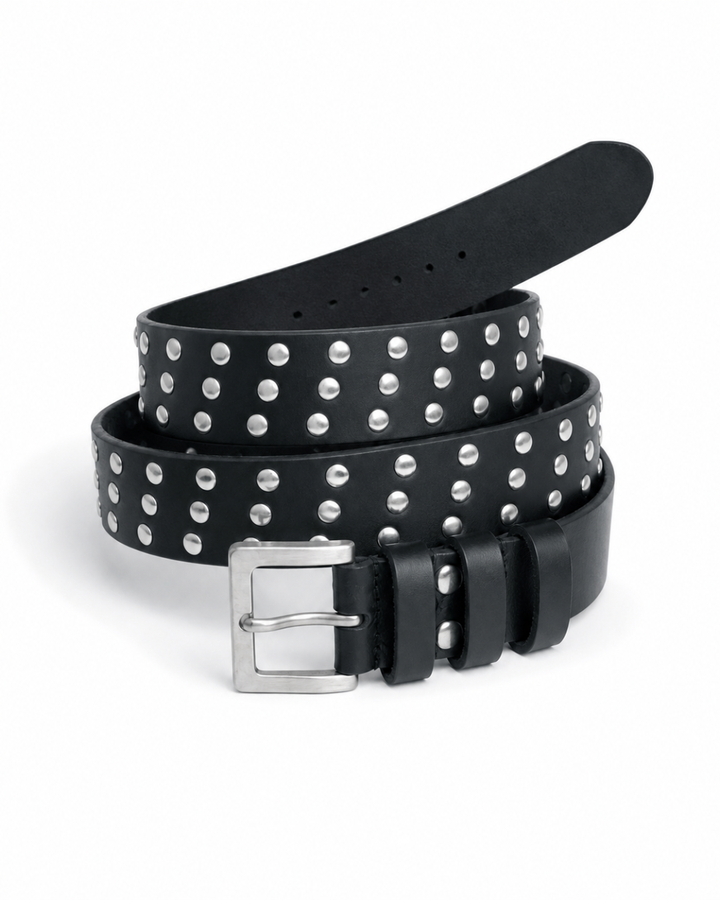 Black leather studded waist belt coiled on white background showing two rows of silver dome-head studs and square silver pin buckle