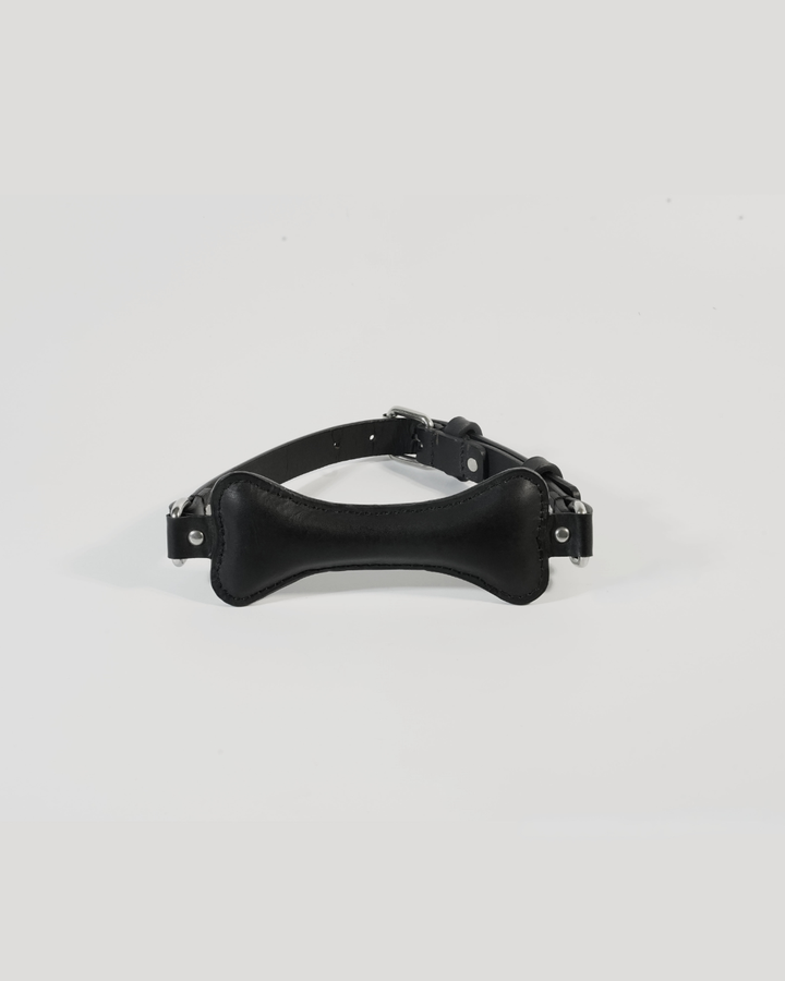 Fetch leather bone gag in black full grain leather, front view showing padded bite piece and D-rings