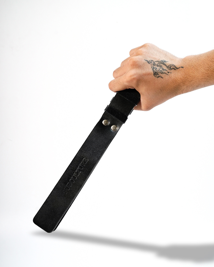 Three Layer Leather Paddle Whip in Classic Black - triple-layer construction, looped base grip, handcrafted by Subculture India