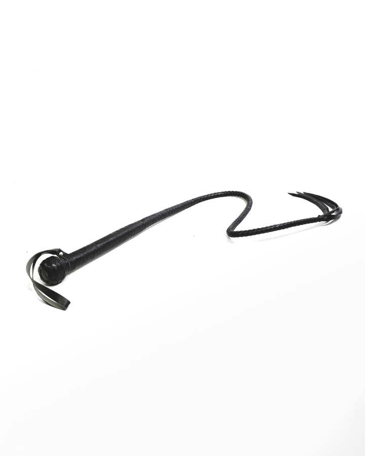 Scorpion Hunter braided leather whip on white background — full length showing diamond-braid shaft, ball pommel, wrist loop and leather falls at tip