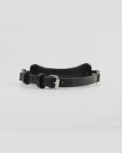 Fetch leather bone gag assembled with adjustable strap, angled side view showing steel buckle