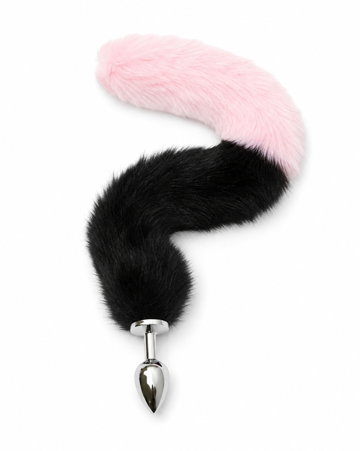 Fox tail butt plug front view — black-to-pink ombre faux fur tail with polished stainless steel plug at base, product shot on white, Leathersubculture