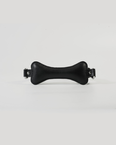 Back of Fetch leather bone gag showing SUBCULTURE embossed leather strap and roller buckle closure