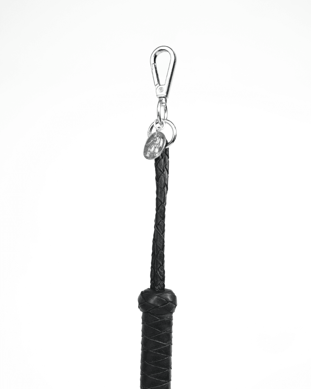 Mini Flogger Leather Charm, genuine leather impact toy by Subculture, worn view