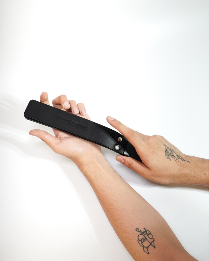 Three Layer Leather Paddle Whip detail - rivet and loop binding at base, flexible leather layers, BDSM impact toy India