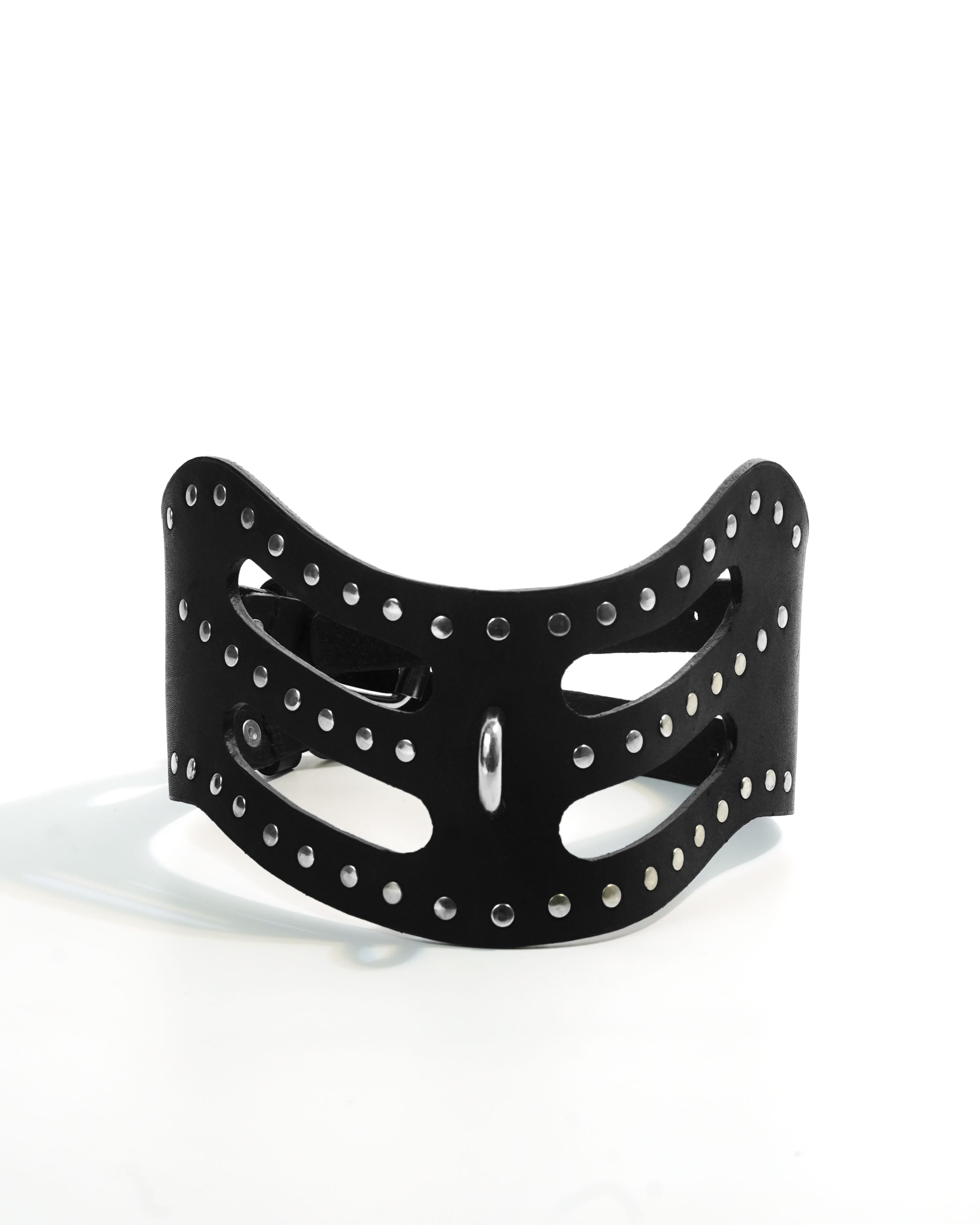 Cipher Collar — wide black leather collar with precision cut-out slots and chrome stud rivets, double buckle closure and O-ring, flat lay on white background