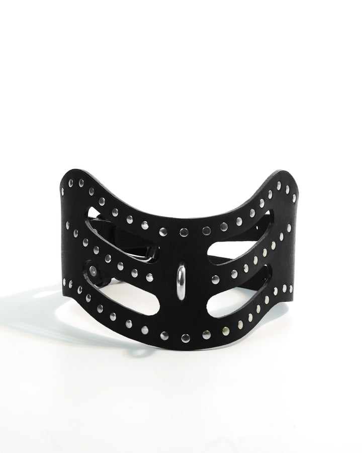 Cipher Collar — wide black leather collar with precision cut-out slots and chrome stud rivets, double buckle closure and O-ring, flat lay on white background