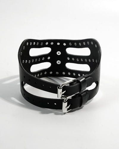 Cipher Collar front — architectural black leather collar with chrome stud detailing and cat-eye mask silhouette, chrome O-ring at center front, Subculture India