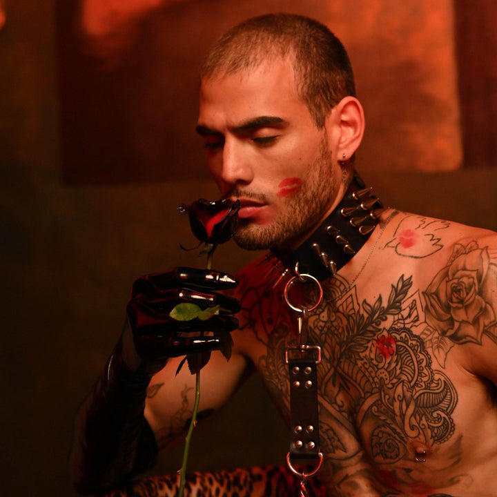 Subculture Rave Collar on a tattooed male model in a red-lit gothic set, paired with a leather chest harness