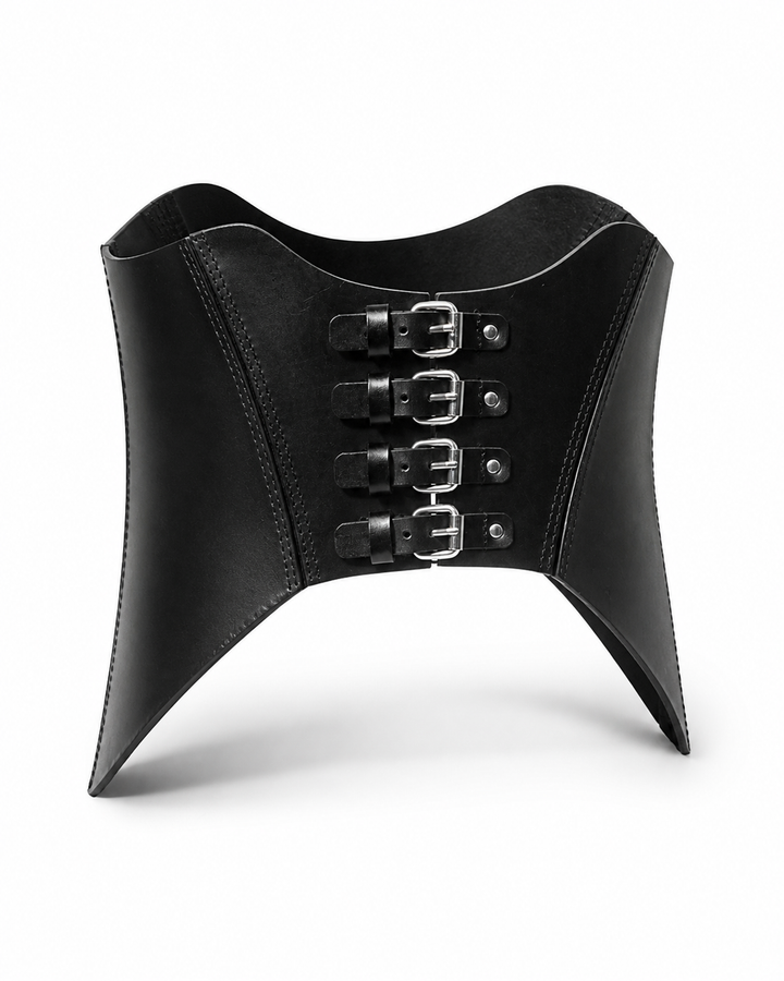 Rhiamon Unisex Leather Corset product shot front view, standing upright showing curved scalloped top edge, 4 stacked silver buckles and flared pointed lower corners, Leathersubculture